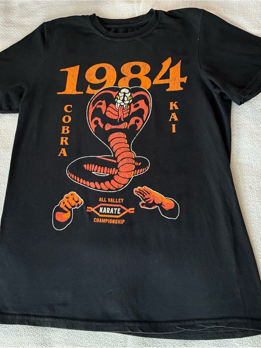 1984 Cobra Kai Graphic Short Sleeve Tee - Black/Orange